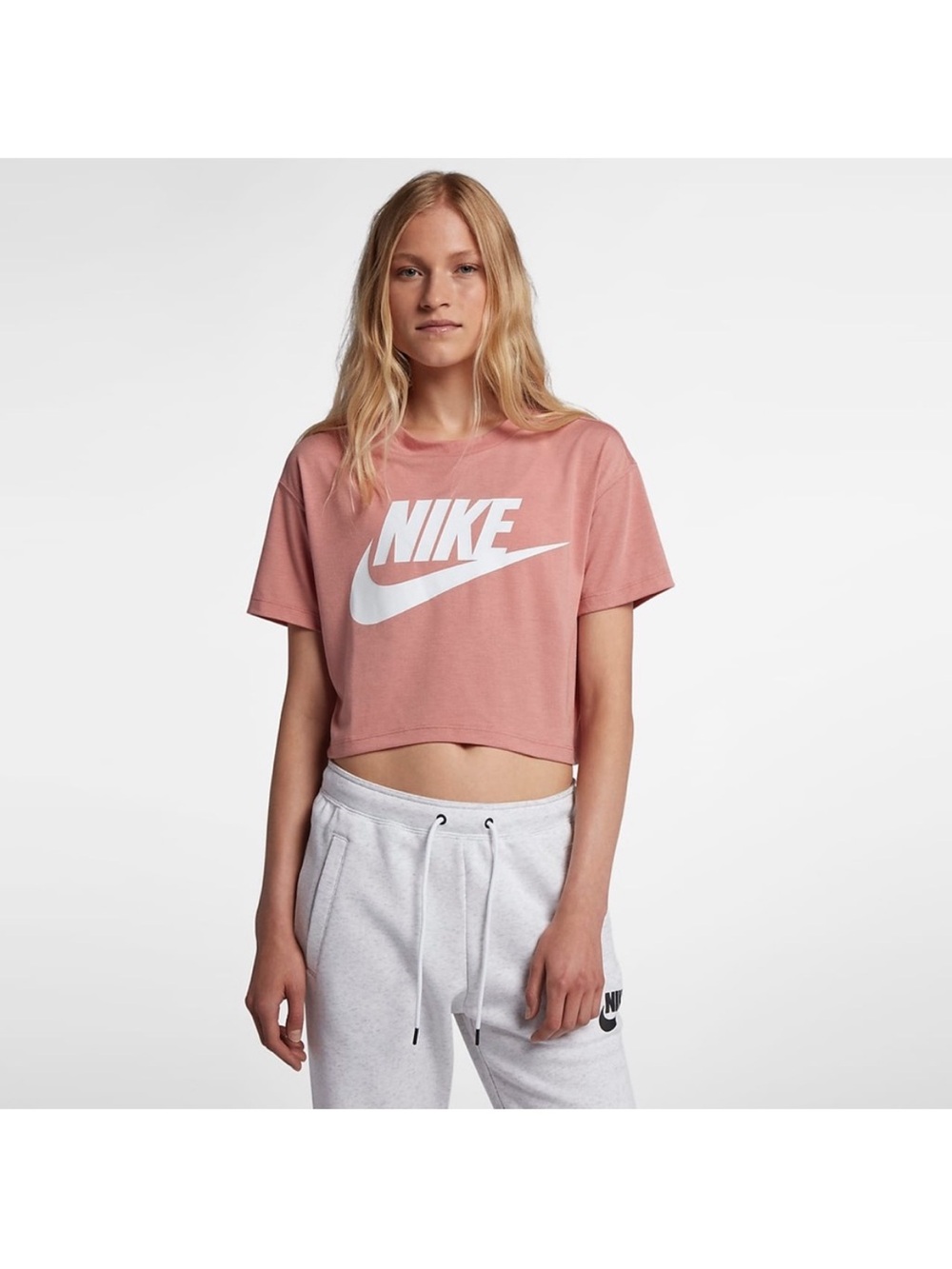 Nike Essential Cropped
Women's Short-Sleeve Top salmon pink in color